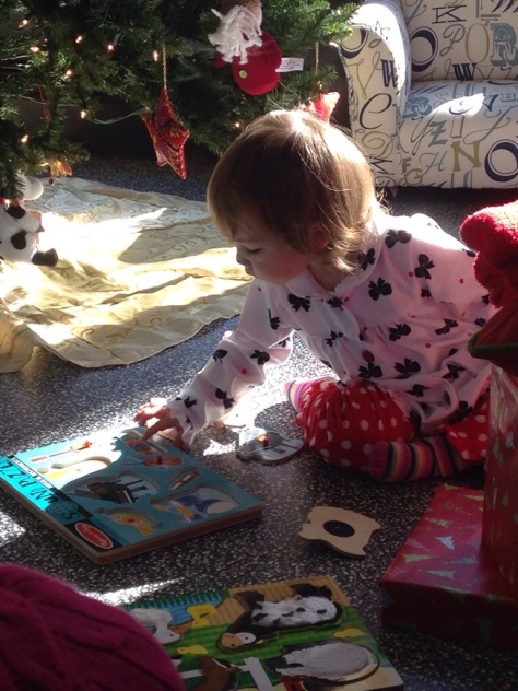 Christmas morning, 2013, EK playing with her instruments puzzle (that makes sounds!)